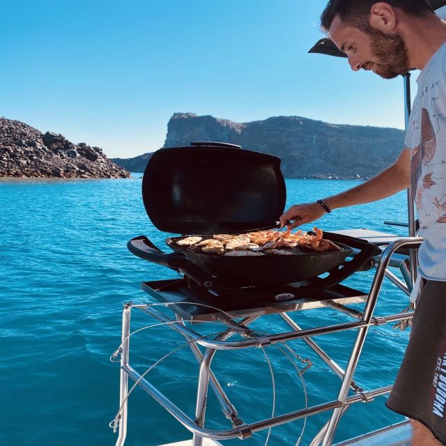 Santorini: Catamaran Cruise with Lunch, Drinks, & Oia Visit - Lighthouse, White Beach, and Red Beach