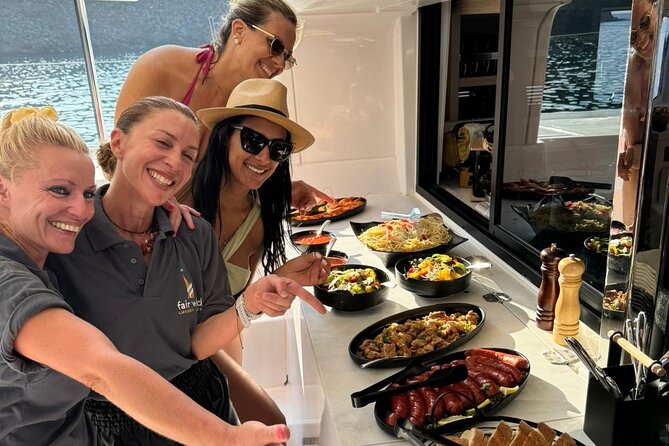 Santorini Catamaran Cruise with Meal and Drinks - Red Beach from the water