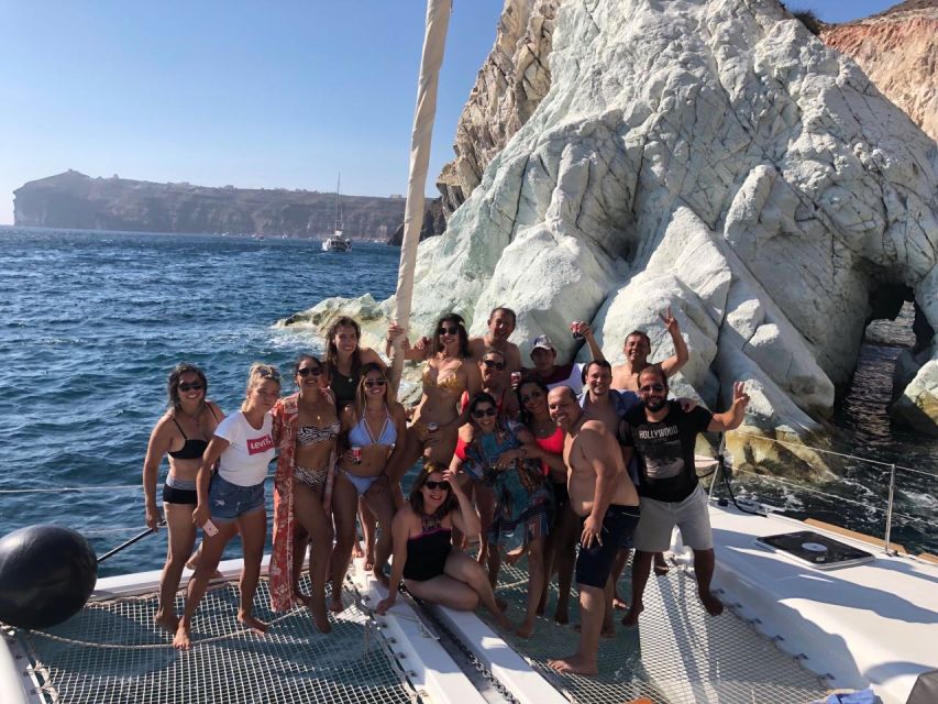 Santorini: Catamaran Cruise with Meal & Open Bar - The Akrotiri lighthouse and the volcanic Caldera
