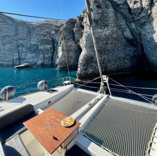 Santorini Catamaran Cruise with Swimming, Meal and Open Bar - Indian Rock, Black Mountain, and the ride back