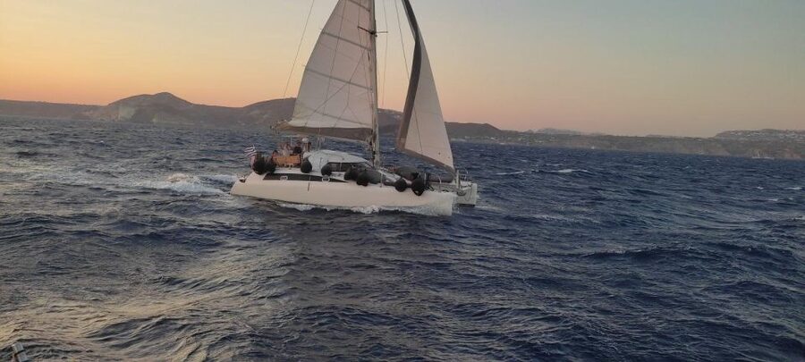 Santorini:Catamaran: private cruise with food & drinks - White Beach, reached only by boat