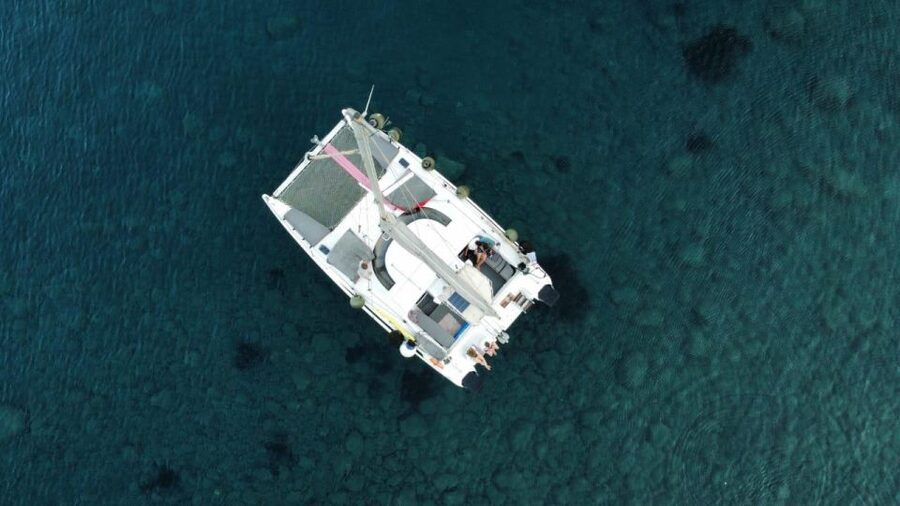 Santorini:Catamaran: private cruise with food & drinks - Black Mountain and Indian Rock