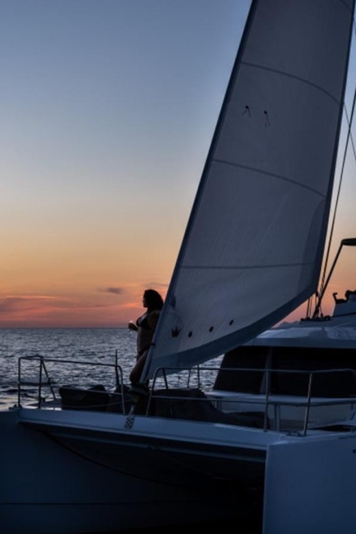 Santorini Catamaran Sunset Skyline Cruise - Red Beach brings the first swim