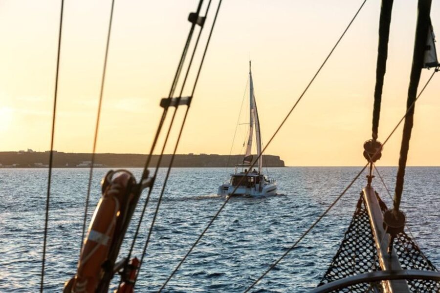 Santorini Catamaran Sunset Skyline Cruise - The Akrotiri Lighthouse marks the turn into the caldera
