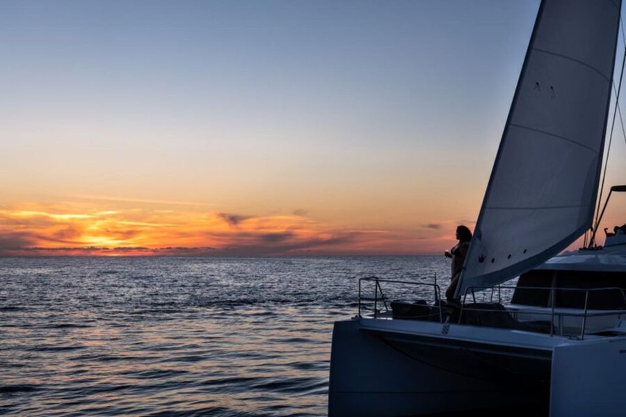 Santorini Catamaran Sunset Skyline Cruise - White Beach and Mesa Pigadia slow the pace