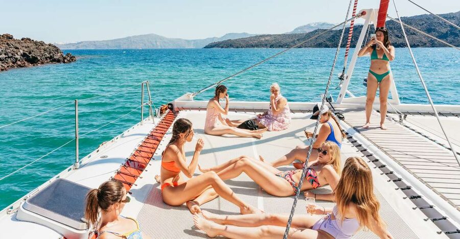 Santorini: Catamaran Tour with BBQ Dinner, Drinks, and Music - A five-hour view of Santorini from the water