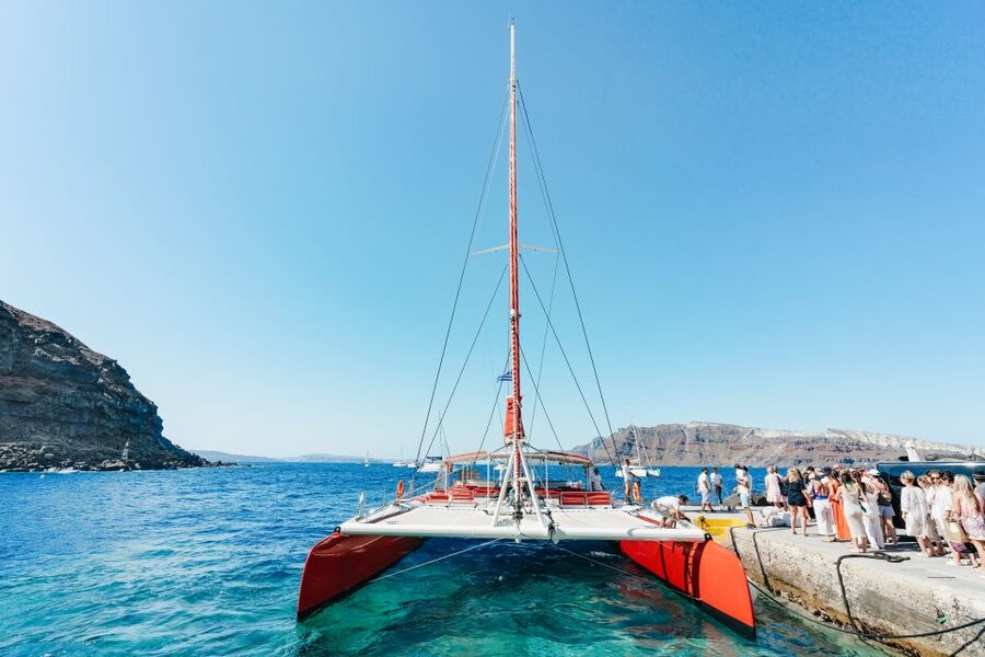 Santorini: Catamaran Tour with BBQ Dinner, Drinks, and Music - Hot springs first, then the volcanic coast