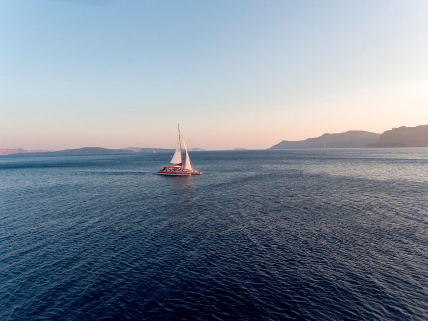 Santorini: Cruise Catamaran with BBQ & Drinks Day or Sunset - Red Beach: Swimming, Snorkeling, and Photos