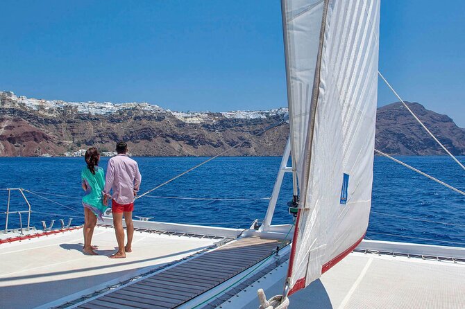 Santorini Cruise on Catamaran with BBQ & Open Bar - Red Beach, black rock, and the caldera cliffs