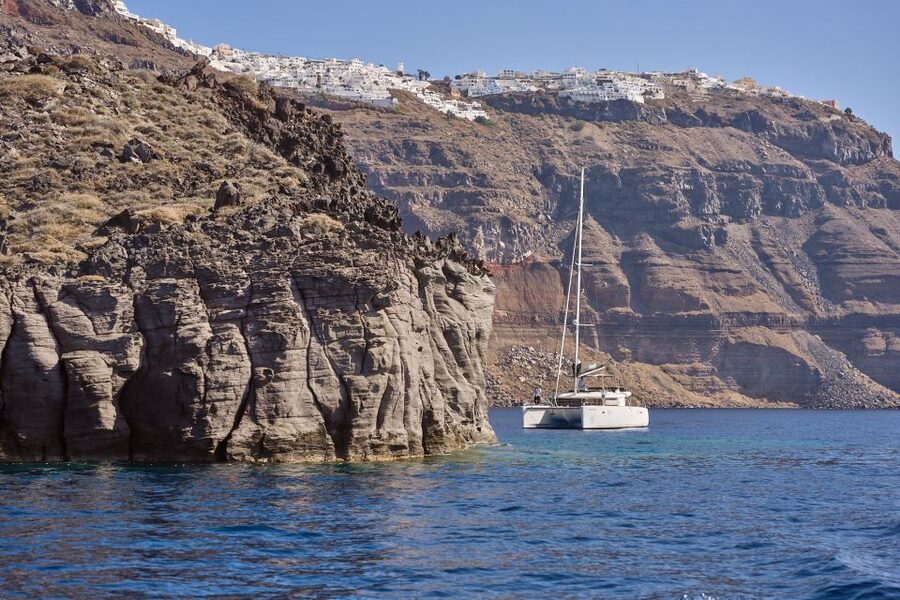 Santorini: Day Luxury Catamaran Cruise with Meal & Drinks - Black lava and the volcanic islets