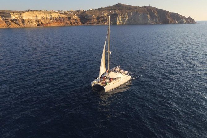 Santorini Full Day Catamaran Private Cruise incl. Meal, Drinks & Free Transport - Volcanic islands and the hot springs