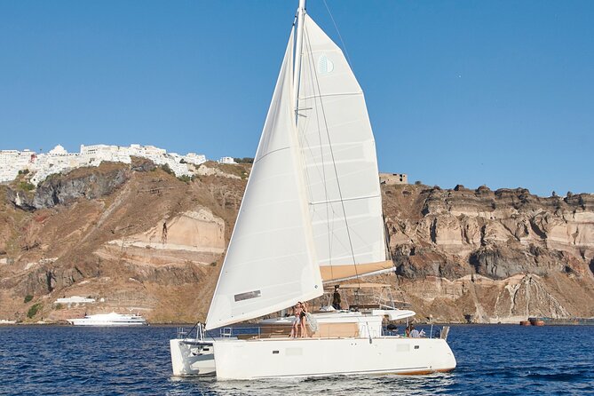 Santorini Gold Catamaran Cruise with BBQ, Drinks and Hotel Pickup - Mesa Pigadia combines the best swim stop with lunch