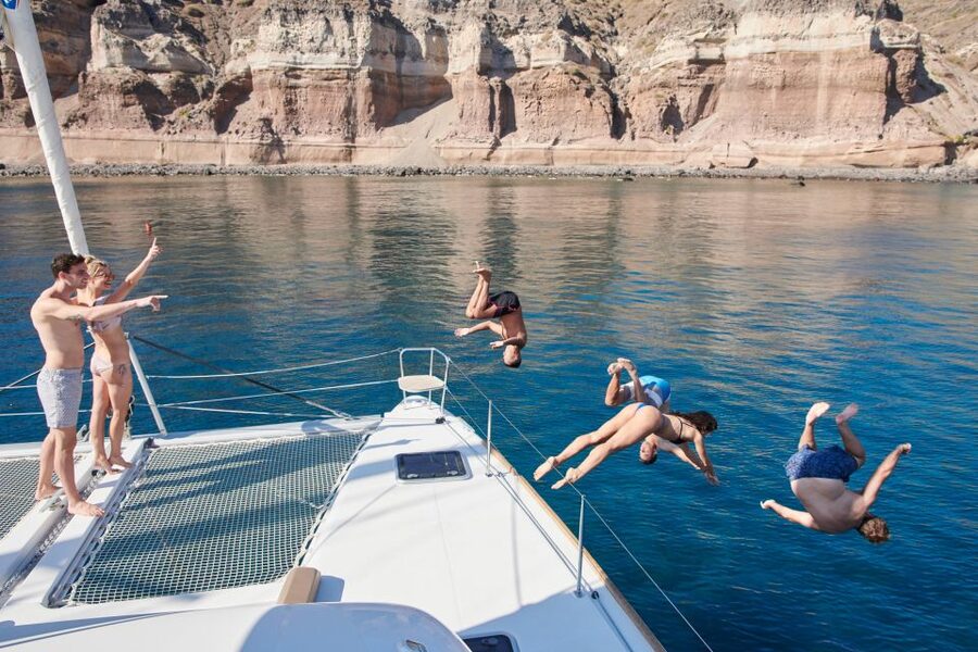 Santorini Gold Catamaran Cruise with Snorkel, BBQ & Open Bar - White Beach and the Venetian lighthouse