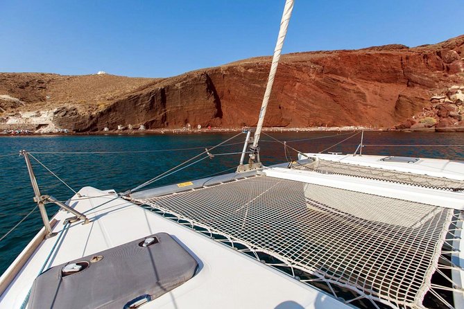 Santorini Half Day Catamaran Private Cruise incl. Meal, Drinks & Free Transport - Mesa Pigadia, the best quiet beach stop