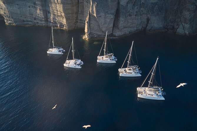 Santorini: Luxury Catamaran Cruise with Fresh Fish BBQ & Drinks - Swimming at Mesa Pigadia Beach