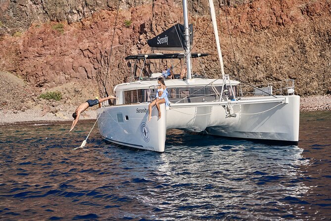Santorini: Luxury Catamaran Cruise with Fresh Fish BBQ & Drinks - The Lighthouse and the Southern Tip
