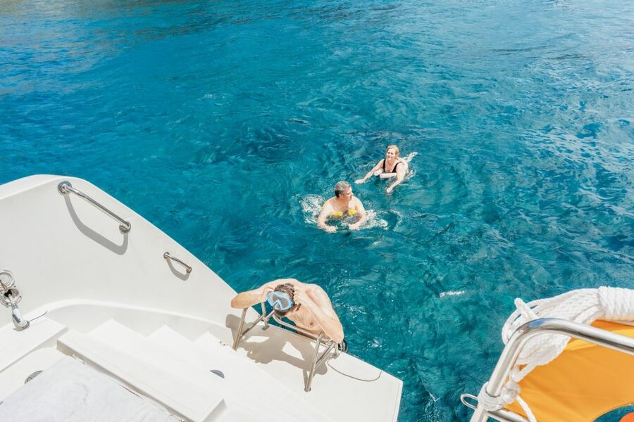 Santorini: Luxury Catamaran Day Trip with Meal and Open Bar - A Greek meal cooked aboard