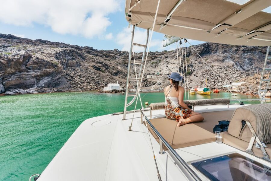 Santorini: Luxury Catamaran Day Trip with Meal and Open Bar - Life aboard the catamaran