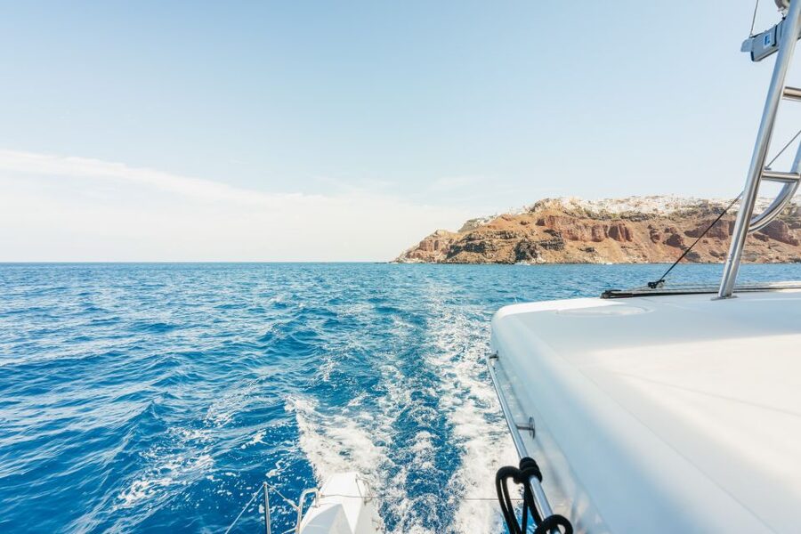 Santorini: Luxury Catamaran Day Trip with Meal and Open Bar - What weather can change