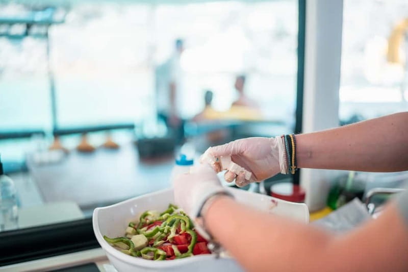 Santorini: Majestic Catamaran Cruise with Meal and Drinks - Lunch with Greek dishes, BBQ, and local drinks