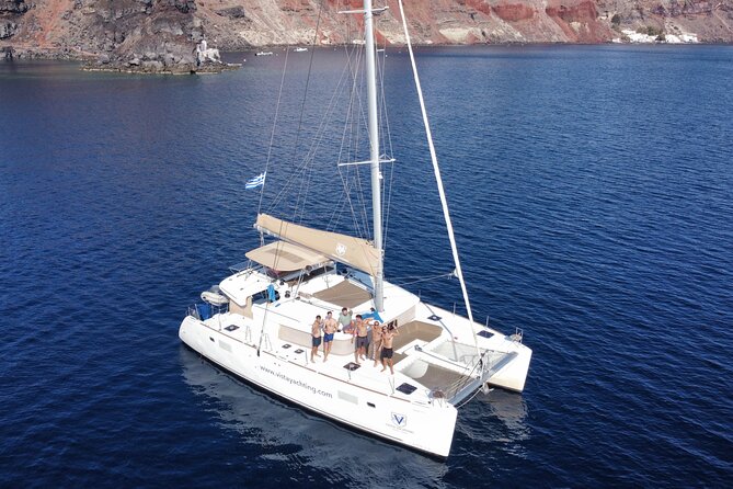 Santorini Platinum Catamaran Cruise with Meal, BBQ and Open Bar - The Akrotiri lighthouse from the water