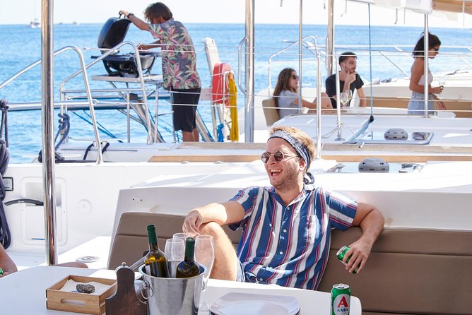 Santorini Platinum Catamaran Cruise with Meal, BBQ and Open Bar - Food, music, and the social side of the boat