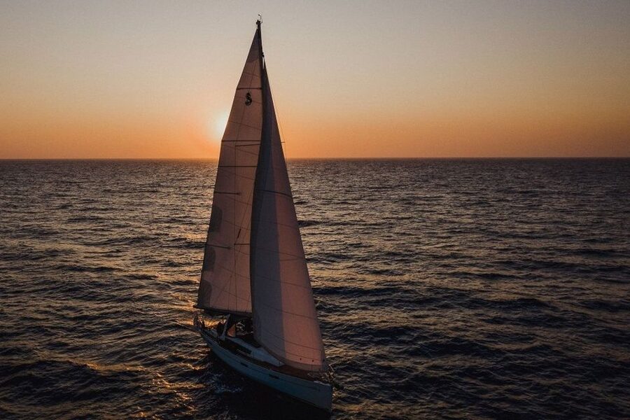 Santorini: Private Caldera Sailing Trip with Open Bar & Meal - Black Mountain and the quiet coves