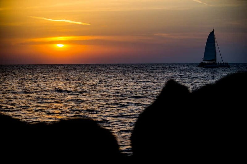 Santorini: Private Catamaran Cruise with BBQ Meal and Drinks - Red Beach, White Beach, and the southern coast