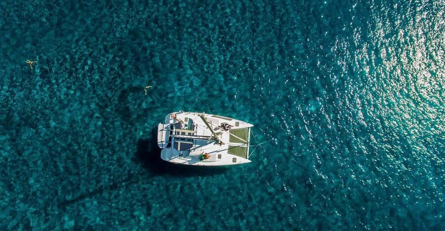 Santorini: Private Catamaran Cruise with Food & Drinks - Swimming and snorkeling near Mésa Pigádia