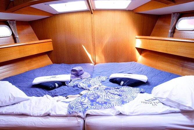Santorini: Private Sailing Yacht Cruise with Meal and Drinks - Mesa Pigadia, a quieter black beach stop