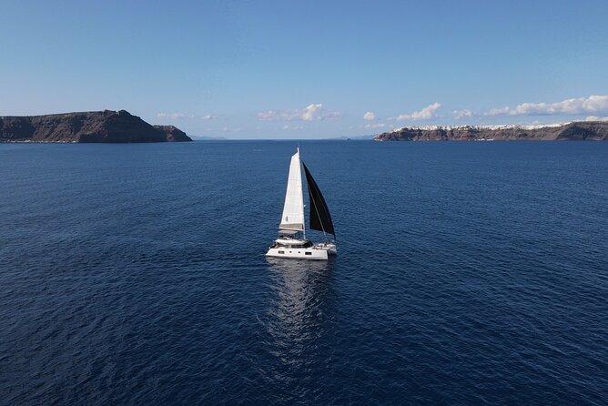 Santorini Private Tour Half-Day Sailing Platinum Catamaran Cruise - Why sailing gives you a better Santorini view