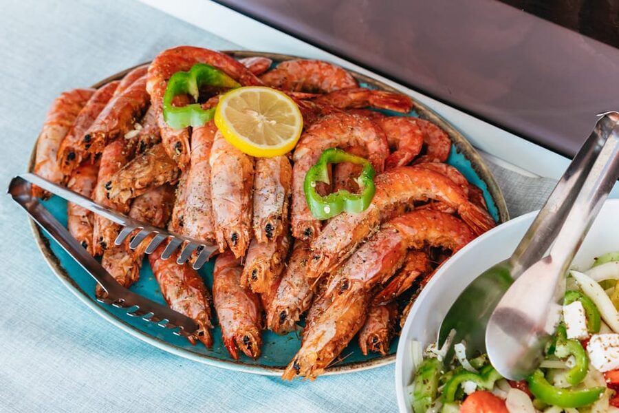 Santorini: Sailing Catamaran Cruise with BBQ and Drinks - Mesa Pigadia, snorkeling, and the BBQ