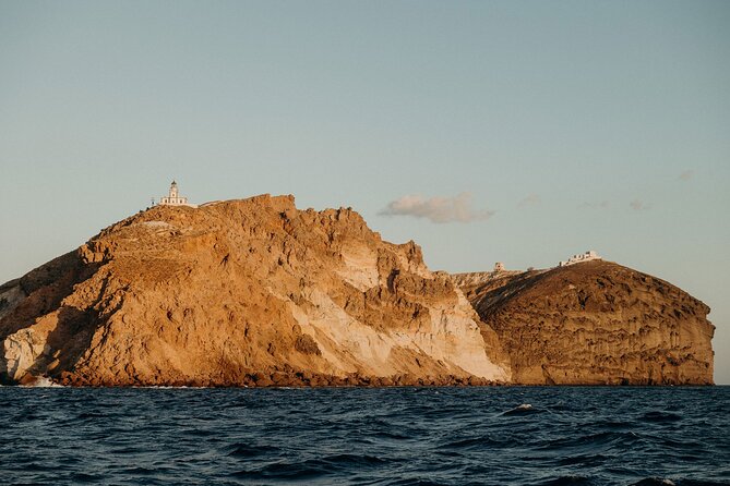 Santorini Semi-private Morning or Sunset Volcano Sailing Tour - Red Beach offers strong color and a short photo stop