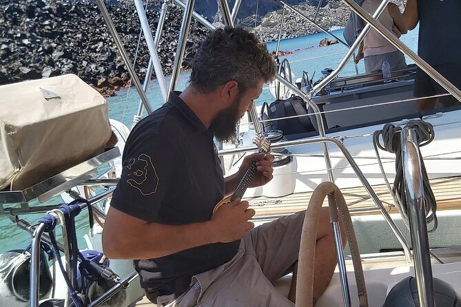 Santorini Semi-private Morning or Sunset Volcano Sailing Tour - Mavro Vouno and Akrotiri Lighthouse add a sense of place