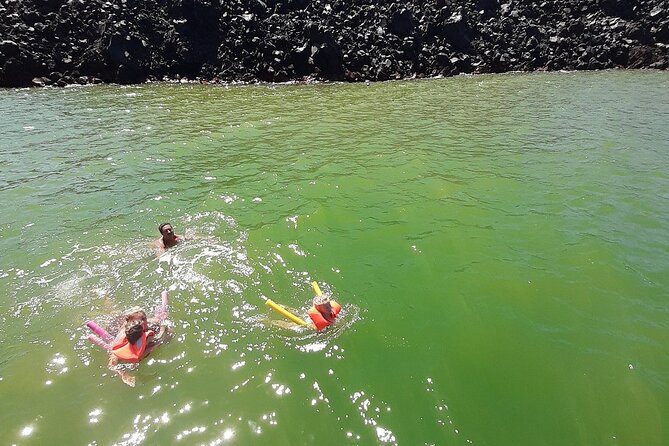 Santorini Semi-private Morning or Sunset Volcano Sailing Tour - Entering the caldera changes the scale of the trip