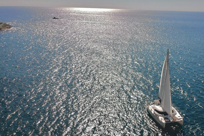 Santorini: Special Occasions Catamaran Cruise, All Inclusive - Red Beach: the first major swim stop