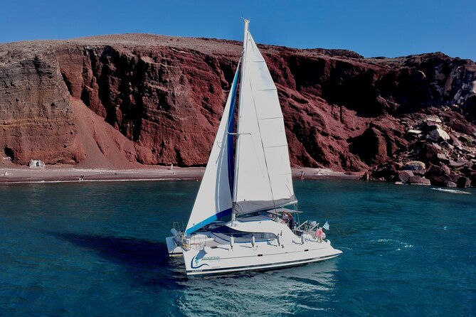 Santorini: Standard Small-Group Catamaran Cruise with Food/Drinks - Red Beach gives you the first swim