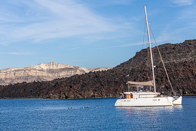 Semi Private Santorini Catamaran Tour - Red Beach, Santorini’s most dramatic shore