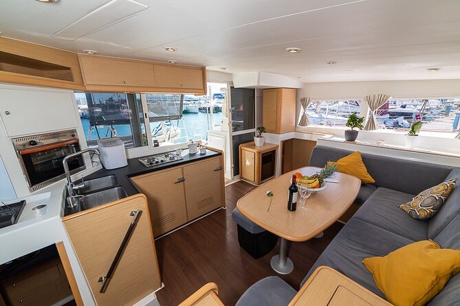 Small Group Santorini Catamaran Cruise with BBQ - Red Beach and the Akrotiri Coast