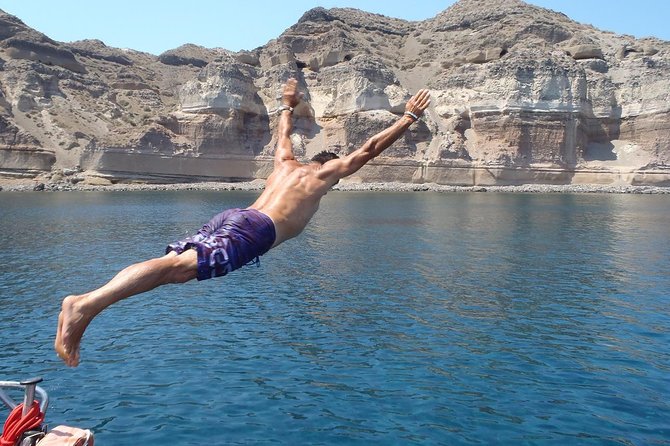 Sunset Caldera Sailing Cruise - Akrotiri Lighthouse and the volcanic islands